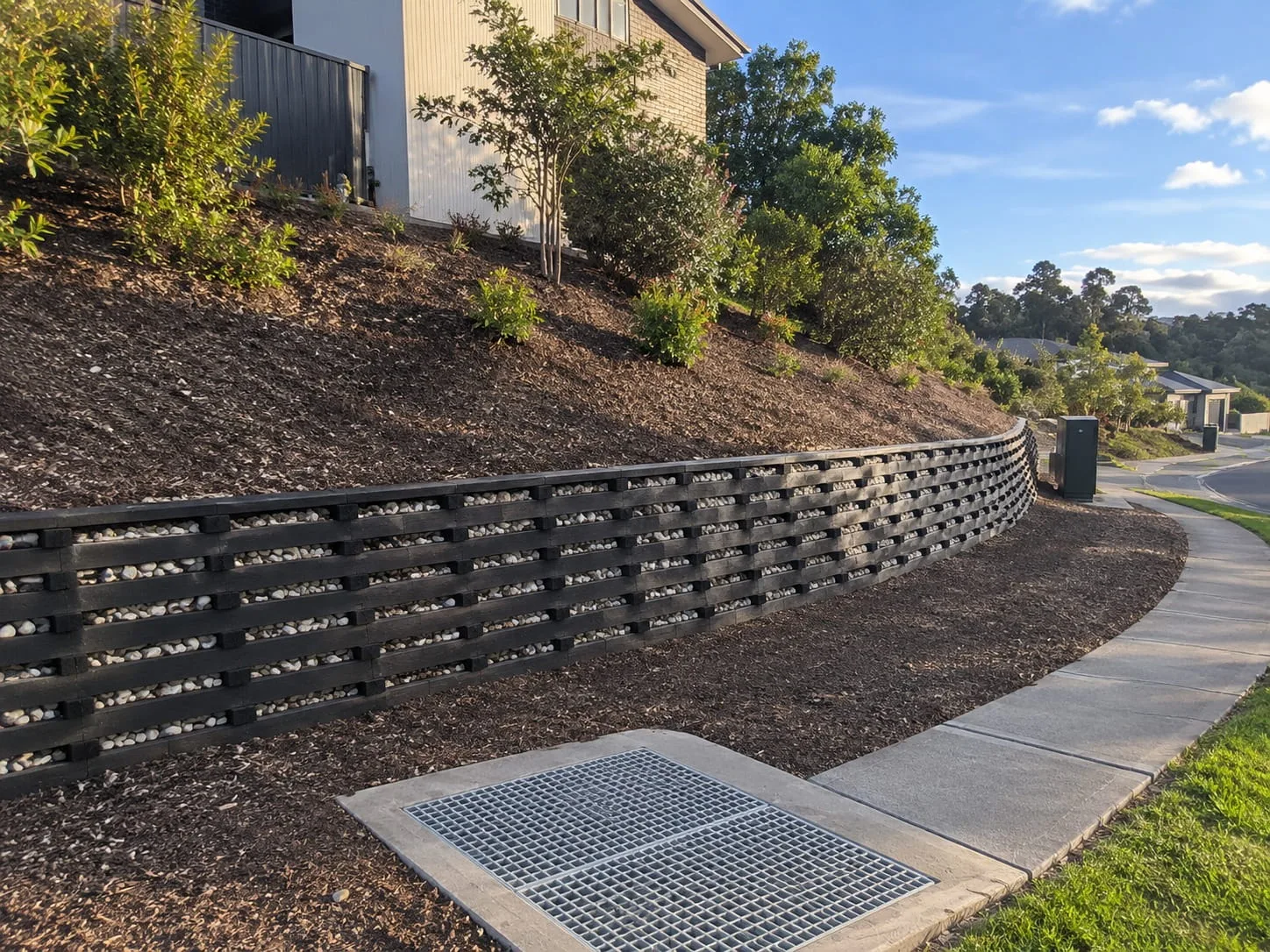Concrete sleeper retaining wall on a Christchurch property
