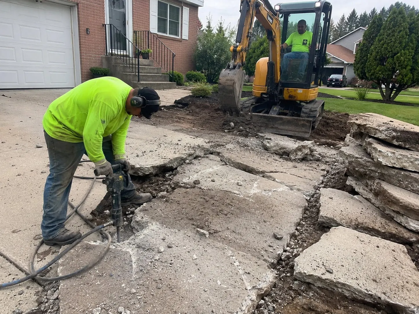 Concrete removal contractors breaking out a slab in Christchurch