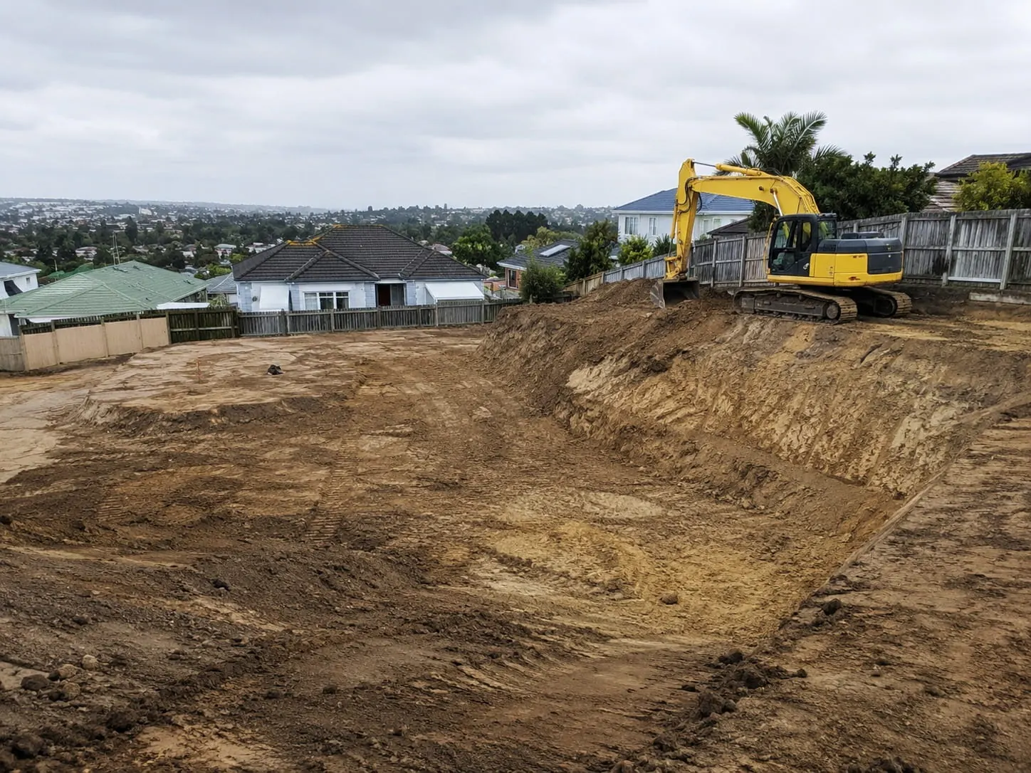 Digger and operator working on a Christchurch earthworks job